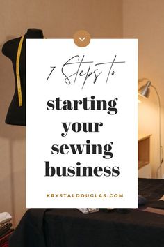 a white sign that says 7 steps to starting your sewing business on top of a bed