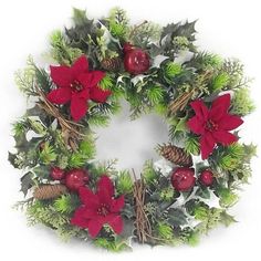 a christmas wreath with poinsettis, holly and pine cones on the front