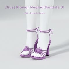 a pair of white and purple high heeled sandals with flowers on the ankle straps