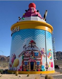 a large colorful building sitting in the middle of a desert