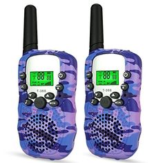 two walkie talkies sitting side by side on top of each other in camouflage print