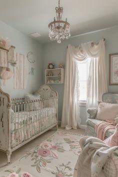 a baby's room with a crib, rocking chair and chandelier