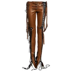 ▪ Dolce & Gabbana tan leather pants ▪ 100% Sheepskin leather ▪ Metal grommets ▪ Multiple black lace-up fastenings ▪ Three buckles at waist ▪ Four long belt straps hanging from hips ▪ Hanging metal 'D' and 'G' detail ▪ Size IT 38 - FR 34 - UK 6 - US 2 ▪ Spring-Summer 2003 Shakira Costume, Punk Cowgirl, Tan Leather Pants, Lace Up Leather Pants, Fancy Club, Silhouette Fashion, Tan Outfit, Erika Jayne, Silver Makeup