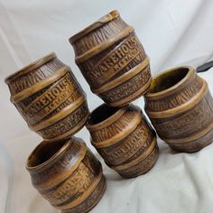 five wooden cups are stacked on top of each other