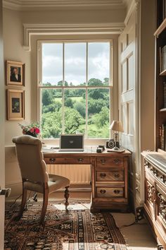 a desk with a laptop on top of it in front of a window overlooking the countryside