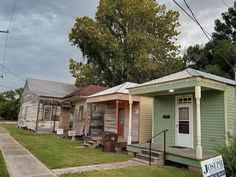 several small houses are lined up on the street