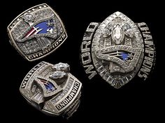 three nfl championship rings with diamonds on them