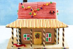 a gingerbread house with decorations on the roof