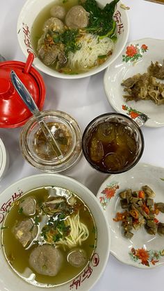 several bowls of soup are on the table