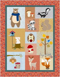 a quilt with animals and trees on it