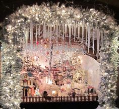 a christmas display with white lights and decorations