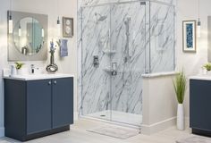 a bathroom with marbled walls and flooring, including a walk - in shower