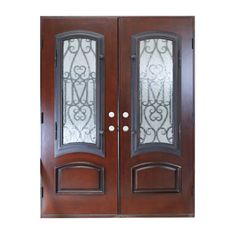 double doors with glass panels and wrought iron designs on the top part of each door