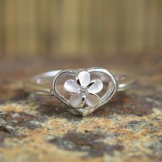 Hawaiian Silver Plumeria Flower In Heart Love Cz Wedding Ring Band 8Mm Sr3121 White Heart Ring For Wedding, White Flower Shaped Promise Ring, White Flower Shape Promise Ring, Silver Heart Ring For Wedding, White Sterling Silver Heart Ring For Wedding, White Dainty Heart Ring For Promise, White Flower Ring For Promise, Dainty White Heart Ring For Promise, Delicate White Gold Heart Ring For Wedding