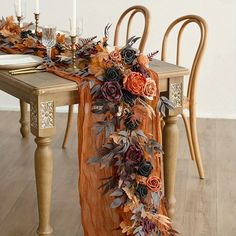 the table is decorated with flowers and candles for an elegant touch to the dining room