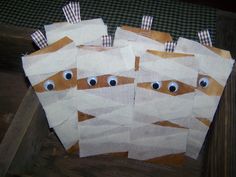 three pieces of paper with googly eyes on them