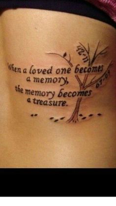 a woman's stomach with a tattoo saying, when a loved one becomes a memory, the memory becomes a treasure