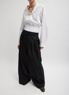 Crafted from a familiar and crisp eco-poplin, this Scoopneck Top will catalyze low-effort, high-style outfitting, through the lens of Creative Pragmatism, this fall. Its minimalist design and clean lines make it a versatile staple, perfect for layering or wearing alone. Pair back to the Fluid Suiting Derrick Men’s Trouser and a Larry heel for the perfect balance of Chill, Modern, and Classic. 100% Cotton Style Number: F124EC7894 Available in: White Multi Hyphenate, Bohemian Jewels, Elevated Basics, Pants Fit, Pleated Pants, Jacket Sale, Skirts For Sale, Cotton Style, Sweater Jacket