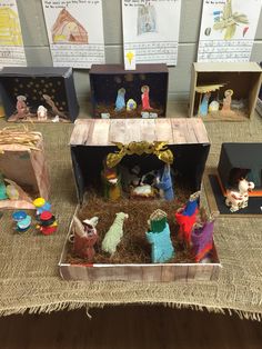 the nativity scene is displayed on display in front of children's books and toys