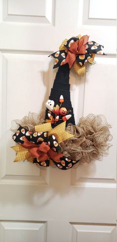 a door hanger decorated with fall decorations