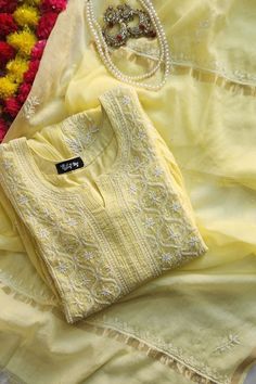 Nibs Tog Yellow Roohani Mulmul Chikankari Kurta Dupatta Set (Customizable) Step into the magic of Lemon Yellow Mulmul Chikankari Kurta with Dupatta Set. Immerse yourself in: Inspiration:  Crafted with inspiration from traditional elegance and modern trends. Creation Process:  Meticulously hand-dyed, embroidered, and adorned with pearls for a unique touch. Versatile Use:  Perfect for festivals, weddings, Haldi ceremonies, and special occasions. Benefits: -Comfortable and soft fabric -Customizable to express your style -Handcrafted for a unique touch -Embellished with Pearls detailing -Kurta Length: 50 Inches(Can be altered) Customization Options: Option 1: Semi Stitched Kurta+ Dupatta Option 2: Stitched Kurta + Dupatta Option 3: Stitched Kurta+ Dupatta+ Leggings(Soft Lycra fabric Ankle leng Chikankari Kurta Set With Dupatta, Cotton Kurta Set With Dupatta, Esty Shop.com Clothes, Lemon Yellow Kurti, Chikankari Kurta With Dupatta, Yellow Chikankari Suit, Yellow Churidar, Chikankari Kurta Set, Kamiz Design