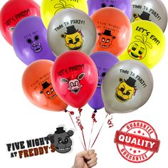 a bunch of balloons with faces on them