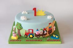 a birthday cake with farm animals on it