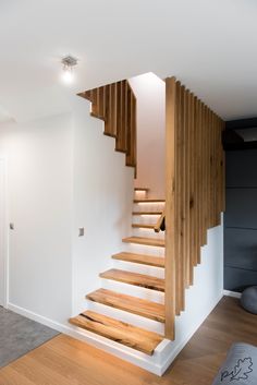 there is a wooden stair case in the house