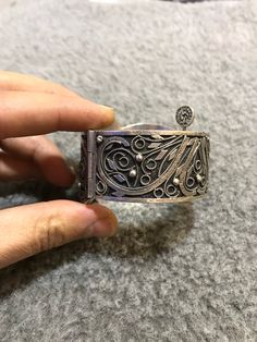 A beautiful antique Algerian silver bracelet with Morocco silver marks, silver filigree, with a sliding pin closure. Handmade from 80 percent silver. The filigree is in good condition and the bracelet functions as it should. It is in general in good vintage condition. Width of large side : 5cm Width of small side : 2,8 cm Inner diameter : 5,9cm Weight : 67,9g Traditional Adjustable Filigree Bracelets, Adjustable Traditional Filigree Bracelets, Bohemian Filigree Cuff Bracelet, Antique Silver Bracelet With Intricate Design, Ornate Sterling Silver Filigree Cuff Bracelet, Traditional Filigree Cuff Bracelet Bangle, Traditional Filigree Cuff Bangle Bracelet, Bohemian Silver Filigree Bracelets, Traditional Sterling Silver Filigree Bracelet