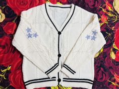 Embrace the elegance and charm of this beautifully crafted cardigan, inspired by folklore themes. Made from high-quality materials with a keen eye for detail, this cardigan is designed to offer both style and comfort. Please note that this is a high-quality remake and not an official merchandise item. Versatile & Elegant: This cardigan is perfect for any occasion--be it casual wear at home, a day at the office, or a special event such as parties, cocktails, dates, weddings, or outdoor adventures. It makes an excellent Valentine's Day gift for that special someone. Classic & Essential: Ideal for transitioning between Spring and Fall, and a must-have for Winter. This cardigan is a timeless addition to any wardrobe, especially for music enthusiasts. Designed for Fans: Tailored specifically fo Taylor Swift Folklore Cardigan, Folklore Cardigan, Cardigan Handmade, Taylor Swift Folklore, Cable Knit Cardigan, Music Event, Jumpers And Cardigans, Outdoor Adventures, Cardigans For Women