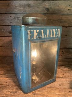 an old fashioned blue metal box with the word evalia on it's side