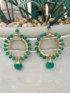 Emerald Hoop Earrings, Gemstone Drop Earrings, Raw Stone Hoops, Birthstone, Green Stone Earrings, 14kt Gold Wrap Earrings, Dangle Hoop Earrings. Designed by me in Los Angeles, CA and handmade by my family in Cusco and Lima, Peru. Materials: 14k French gold wire, Emerald Faceted Gemstones Length: 2.4 inches; Width: 1.18 inch. Closure: Ear wire Made to Order Peruvian Jewelry, Gemstone Drop Earrings, Wrap Earrings, Gold Wrap, Earrings Gemstone, Dangle Hoop Earrings, Lima Peru, May Birthstone, Gold Filled Earrings