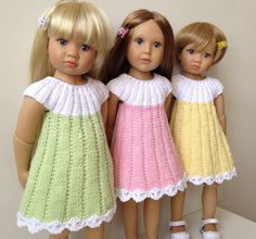 three dolls are standing next to each other