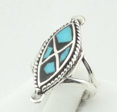 "Vintage sterling silver ring with turquoise inlay. A beautiful ring in the southwest Native American tradition. Possibly Zuni. FREE SHIPPING!! Details: Sterling Silver: (as shown in picture) Turquoise: inlay Approximate Top Dimensions: 1 1/8 inch x 1/2 inch Ring Size: 5 Total Weight: 4.5 grams FREE domestic shipping by USPS Priority Mail Signature Confirmation and includes insurance. If the item is to be shipped internationally Etsy will calculate postage. Please notify us at purchase if you ar Luxury Sterling Silver Turquoise Inlay Ring, Luxury Sterling Silver Turquoise Ring With Inlay, Luxury Turquoise Inlay Ring In Sterling Silver, Mail Signature, Native American Traditions, Vintage Sterling Silver Rings, Turquoise Cuff, Beautiful Ring, Salt Lake City