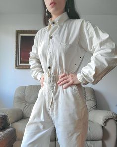 1940s soft cotton coveralls with five pockets. Each cuff has a donut button closure. There are 4 donut buttons on the front with two concealed on the lower half (originally there were 4 but two are missing. Does not affect the wearability or appearance as it's concealed). There are paint and rust and other stains throughout, so evenly done that it makes a beautiful pattern! there are also two small holes on the back left on the upper sleeve and back. Please consult all photos. (Shown on a small Beautiful Patterns, Gender Neutral, Rust, Overalls, Bathing Beauties, Adult Outfits, Cuff, Paint, Purses And Bags