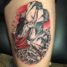 a man's leg with a tattoo on it that has an image of a woman holding