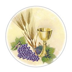 a golden chalice with grapes and wheat on it