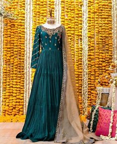 This is a made-to-order Emerald Green long gown MATERIAL DETAILS: Gown: embroidered silk Dupatta: embroidered organza  Trouser: malai crepe Product details: Long emerald green gown, upper gown full of Zardozi work in golded with golden pearl all over the upper body. Below chest down fabric used is crinkle silk  Organze duppata with light gota flower patches laces with gota pati lace on the duppata all 4 sides. Dyed malai trouser NOTE: *NO additional fee will be charged on stitching, the price in Indian Reception Dress, Green Long Gown, Emerald Green Gown, Wedding Outfits For Family Members, Dress Minimal, Engagement Party Dresses, Zardozi Work, Lurex Dress, Nikkah Dress