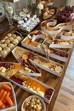 a table filled with lots of different types of snacks and desserts on top of it