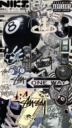 a collage of various stickers and decals on a wall with the words one way