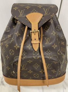 Louis Vuitton Monogram Montsouris Women's Backpack BROWN Leather w/ storage bag Description Condition: Used Brand…LOUIS VUITTON Purchased at an official store. This is a rare backpack as it is out of print. It is a used item with little signs of use as it has only been used a few times, but there are some scratches and dirt. Accessories: Although it is not a storage bag for Monsuri, We will include a replacement VUITTON v The item may have aged deterioration, please check the photos. The accessories are all the ones in the picture. 100% Authentic ! We hope that this item will be great experience for you. If you have a question please contact us. Payment Please pay within 5 days after the auction closed. Shipping Please check "shipping & payments". if you don't understand, feel free to cont Daily Monogram Canvas Backpack With Adjustable Strap, Daily Use Monogram Canvas Backpack With Adjustable Strap, Brown Monogram Canvas Rectangular Backpack, Luxury Brown School Bag, Designer Brown Backpack For School, Luxury Brown Backpack For School, Designer Brown Bag For School, Designer Brown School Bag, Luxury Brown School Backpack