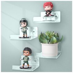 three shelves with various figurines and succulents on them