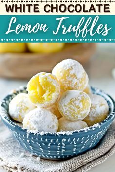 white chocolate lemon truffles in a blue bowl with powdered sugar on top