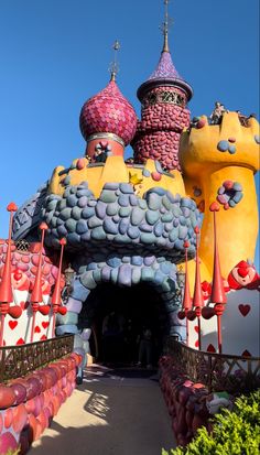 the entrance to an amusement park with colorful decorations