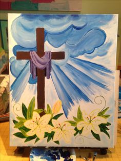 a painting of a cross with flowers on it