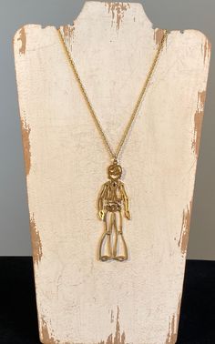 "A clever cut out moving parts Hippie guy.  Classic 60's fun interpreted by the Lisner jewelry company.  Good vintage condition. The pendant is 4 1/4\" long and 1 1/4\" wide.  The twisting chain is 18\". It has a spring lock closure." Gold Hippie Necklace, Retro Soldered Metal Jewelry, Retro Gold Brass Necklace, Spiritual Vintage Pendant Jewelry, Gold 70s Necklaces, 1960s Jewelry Necklaces, Hippie Men, 1960s Fashion, Jewelry Companies