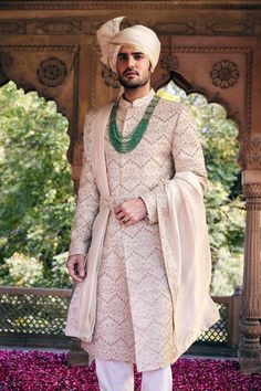 Cream sherwani with embroidered pitta work floral motifs. Comes with inner kurta and churidar.
Components: 3
Pattern: Embroidered
Type Of Work: Pitta,Zardozi
Neckline: Mandarin Collar
Sleeve Type: Full
Fabric: Matka Silk
Color: Cream
Other Details: 
Weight: 2 Kgs
Closure: Sherwani: Front closure
Note: Safaa, belt, neckpiece and dupatta worn by the model is not for sale
Occasion: Wedding,Destination Wedding,Groom - Aza Fashions Cream Sherwani, Pitta Work, Wedding Destination, Churidar, Floral Motifs, Wedding Groom, Embroidered Silk, Mandarin Collar, Aza Fashion