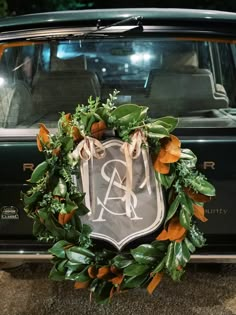 a wreath on the back of a car