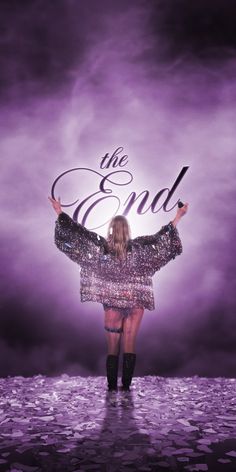 a woman standing in front of a purple background with the word end written on it