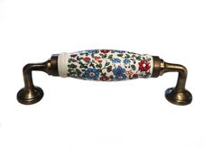 an antique style handle with flowers painted on it